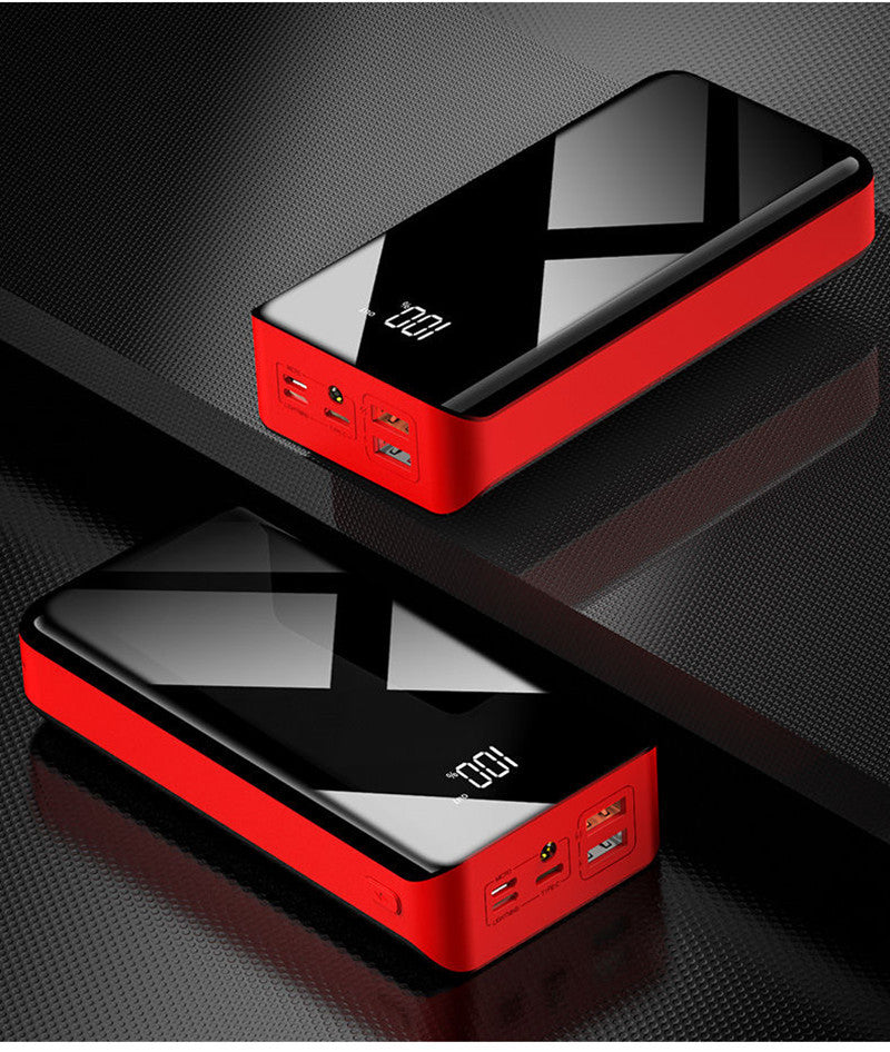 Powerbank z wyświetlaczem LCD obok telefonu
